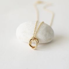 "Beautiful and lovely dainty three rings necklace made of dainty gold three linked circle rings charm with skinny gold plated brass chain. Simple and warm. The necklace is good for yourself or gift! Your necklace will ship in a rudiana gift box. ♥Chain length available in 14\" - 20\" ♥Charm approx. 1/2\" ♥Color : Gold ♥ Delivery Time Fast shipping within 1 - 3 days ♥ See more Rudiana Accessories Rudiana.etsy.com" Pretzel Necklace, Circle Rings, Rose Gold Flats, Prom Necklaces, Triple Ring, Tiny Rings, Rings Necklace, Three Rings, Infinity Necklace