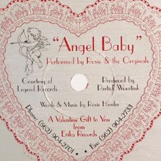 an angel baby cd with the label in the shape of a heart on top of it