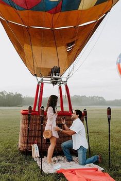 a couple getting ready to fly in a hot air balloon