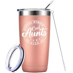 a pink tumbler with an insulated lid and straw is next to the cup