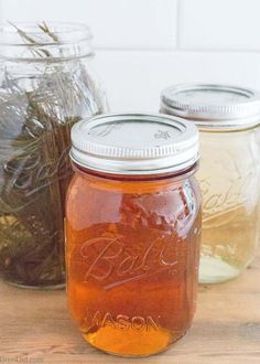 mason jars filled with wildflowers and herbs