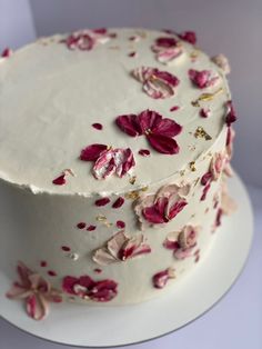 a white cake with pink flowers on it