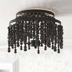 a black chandelier hanging from the ceiling