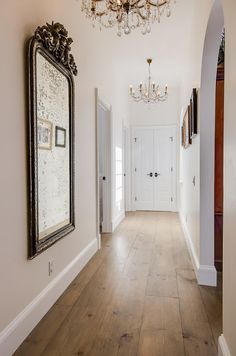 the hallway is clean and ready for us to use as an entrance way in this home