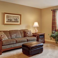 a living room filled with furniture and a window