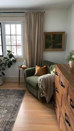 a living room filled with furniture and a large window