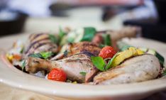 a white plate topped with meat and veggies