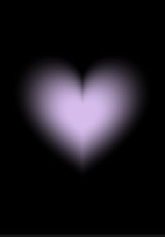 a blurry image of a heart in the dark