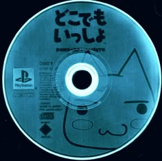 a cd disc with an image of a cat in the center and japanese characters on it