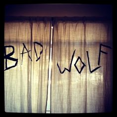 the word bad wolf is spray painted on curtains