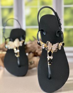 Get ready to fall in love with this elegant design. Our sandals are beloved for their timeless style and exceptional comfort.The glamorous brazilian rhinestone is carefully wrapped to the straps with the most perfect and soft silk yarn. Now you can elevate your look without sacrificing comfort.Each piece is carefully designed and impeccably handmade with the finest brazillian materials.Have a handmade look with a touch of glam. Elegant Open Toe Sandals For Vacation, Elegant Ankle Strap Sandals For Vacation, Elegant Toe Post T-strap Sandals For Party, Elegant T-strap Sandals With Single Toe Strap For Vacation, Elegant T-strap Toe Post Sandals For Party, Elegant Open Toe T-strap Sandals For Vacation, Elegant Black Flip Flops For Vacation, Elegant Sandals With Single Toe Strap For Vacation, Elegant Toe Post Slingback Sandals For Beach