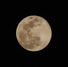 the full moon is seen in the dark sky