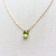 This is a peridot necklace made of genuine high quality faceted peridot. This is a August birthstone necklace. Peridot jewelry is light weight and elegant. This green peridot is around 1 carats. The green stone necklace is great for layering with other gold necklaces. I pay attention to detail and pick the best quality peridot gemstone to make this minimalist necklace. Measurement: 8 mm by 5 mm S for Sparkle on Etsy https://www.etsy.com/shop/sforsparkleshop -------------------------------------- August Birthstone Necklace, Green Stone Necklace, Peridot Jewelry, Peridot Necklace, Basic Jewelry, August Birthstone Jewelry, August Birthstone, 14k Gold Necklace, Peridot Gemstone