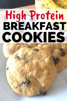 two chocolate chip cookies on a white plate with the words high protein breakfast cookies above it