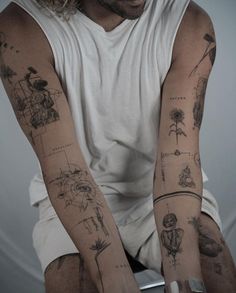 a man with many tattoos on his arms