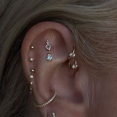 a close up of a person with ear piercings on their left and right ears