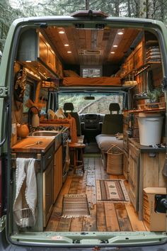 the interior of a van with wood flooring and cabinets in it's cargo area