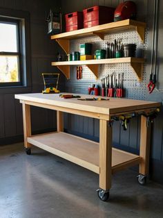 a workbench with lots of tools on it in a garage or workshop area