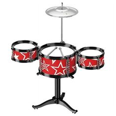 a red and black drum set on a stand with four drums in front of it