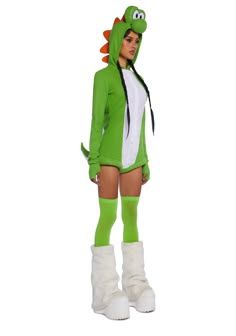 a woman in a green costume is standing with her legs crossed and wearing white boots