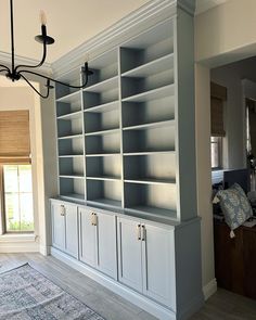 a large bookcase in the middle of a living room