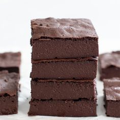 chocolate brownies stacked on top of each other