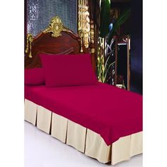 a bed with pink sheets and gold trimmings is shown in front of a mirror