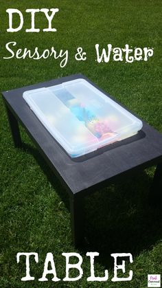 a table that is sitting in the grass with text overlay reading diy sensory and water table