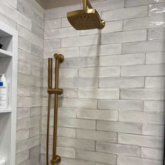 a shower head and hand shower in a bathroom