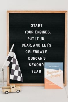 a sign that says start your engines put it in gear and lets celebrate duncan's second year