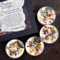 four small cups filled with different types of candies on top of a wooden table