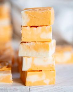 four pieces of yellow soap stacked on top of each other in front of the camera