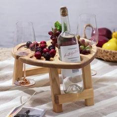 a bottle of wine sitting on top of a wooden tray