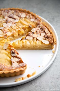 a pie on a plate with one slice cut out