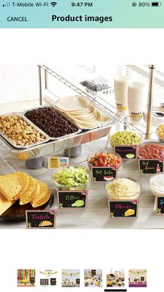 an assortment of tacos and tortilla chips on display at a buffet table