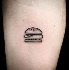 a black and white photo of a hamburger tattoo