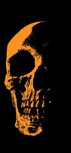 an orange and black skull on a black background