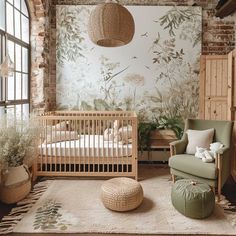 a baby's room with a crib, rocking chair and large wallpaper