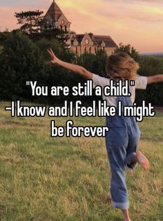 a young boy jumping in the air with his arms spread out, saying you are still a child i know and i feel like i might be forever