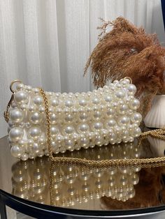 Pearl Bead Bag | Pearl Clutch Bag | Pearl Handbag  ✨ Elevate your style with this handmade white pearl bead bag, combining elegance and sophistication. 🌟 Perfect for weddings, parties, and special events, this bag is a must-have accessory that adds a touch of glamour to any outfit. 💍 - Crafted with high-quality pearl beads for a luxurious look ✨ - Durable and stylish, designed to last 💎 - Ideal for special occasions and formal events 🎉 - Dimensions: [10 cm x 22 cm - (3,93 inch x 8,66 inch) Beaded Beige Bags For Party, Beige Beaded Bags For Party, Pearl White Beaded Shoulder Bag For Party, Elegant Handmade Pearl Shoulder Bag, Chic Pearl Embellished Shoulder Bag, Chic Clutch With Pearl Embroidery, Luxury Bags With Pearl Embroidery, Beige Pearl Embellished Shoulder Bag For Parties, Beaded Pearl Bags For Events