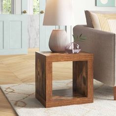 a living room scene with focus on the end table and lamp in the foreground