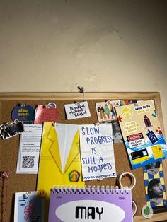 a bulletin board with magnets and pictures on it