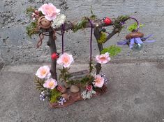 a sculpture made out of branches and flowers