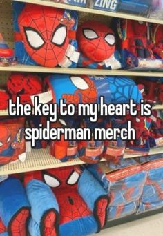 the key to my heart is spiderman merch stuffed animals are on display in a store