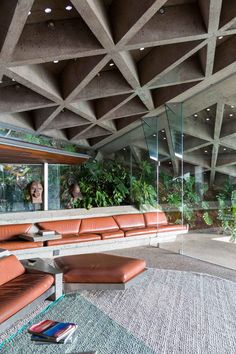 an image of a room with couches and plants