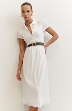 Lacy trim at the collar and sleeves charms this cotton-infused shirtdress cut to a classic midi length. Belt shown not included 47" length (size 8) Button half placket Point collar Short sleeves Unlined 53% Lenzing™ EcoVero™ viscose, 47% organic cotton Dry clean or machine wash, dry flat Imported Reformation Dress, White Midi, Reformation Dresses, Midi Length Dress, Shirtdress, Trending Dresses, Workwear Dress, A Line Skirts, Midi Length