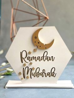 a card with the words raman mubarak written on it and a crescent