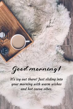 a cup of coffee sitting on top of a white rug next to a wooden tray