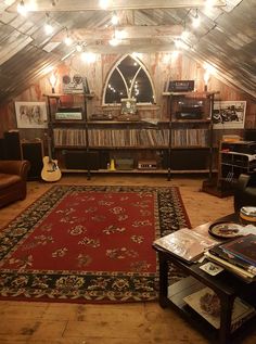 a living room filled with furniture and a red rug