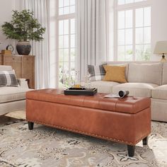 a living room filled with furniture and a rug on top of a carpeted floor